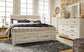 Bellaby Panel Headboard With Mirrored Dresser, Chest And Nightstand at Lee Furniture, NC