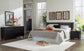 Danziar King Panel Headboard with Mirrored Dresser and Nightstand at Lee Furniture, NC