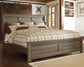 Juararo King Panel Bed with Mirrored Dresser and Chest at Lee Furniture, NC
