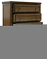 Sturlayne California King Upholstered Panel Bed with Mirrored Dresser, Chest and Nightstand